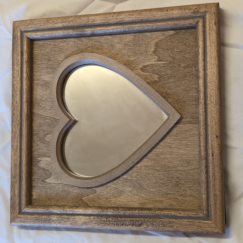 Heart shaped mirror in frame